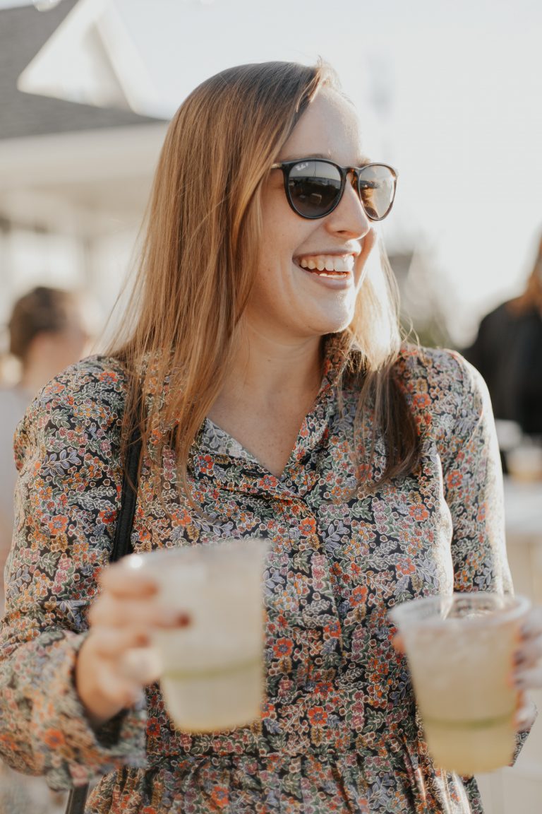 happy woman holding drinks